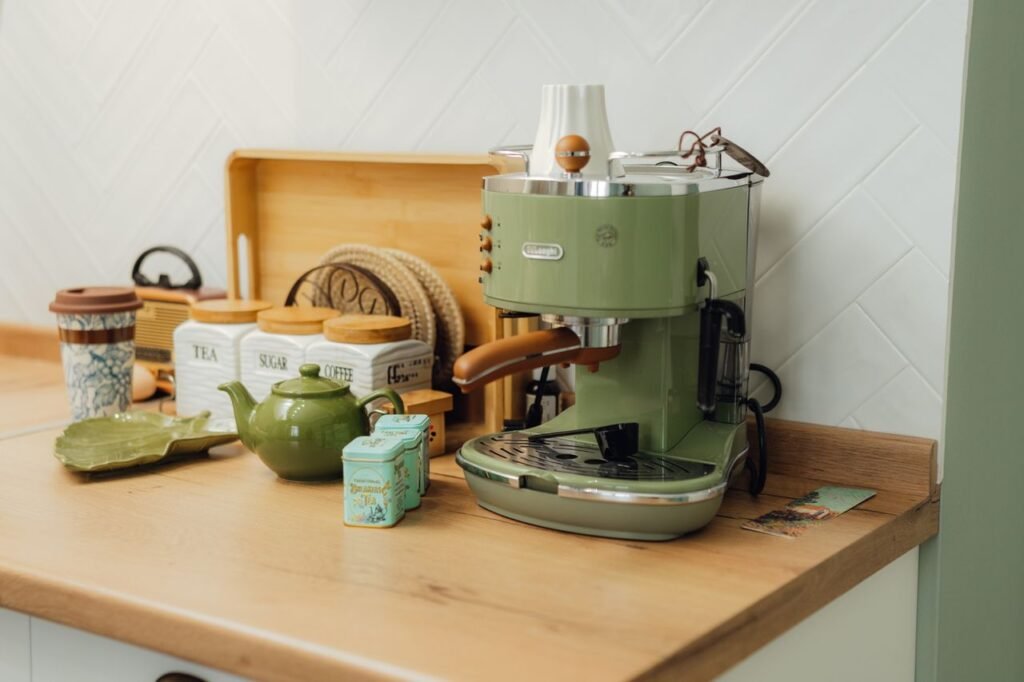 Affordable kitchen decorating ideas featuring stylish countertop décor, wooden cutting boards, glass storage jars, plants, and budget-friendly Amazon kitchen accessories.