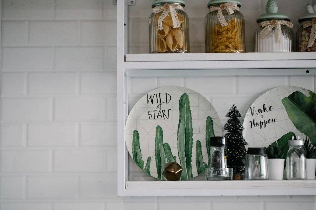 Space-saving multifunction kitchen gadgets including a vegetable chopper, collapsible bowls, over-the-sink cutting board, roll-up drying rack, food processor, and stackable storage containers.